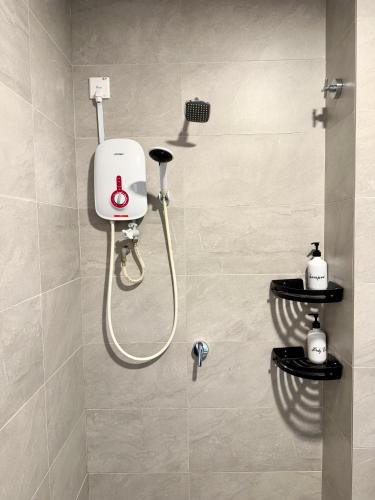 a shower in a bathroom with a shower at Sunsuria Forum SOHO & Residence Suites Setia Alam by MOKA in Shah Alam
