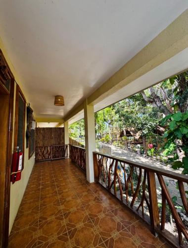 an empty balcony with a view of the trees at Tahanan Resort in San Juan