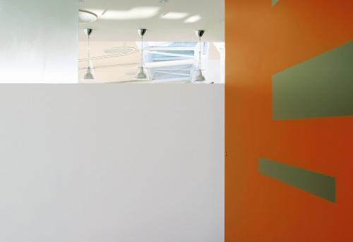 an orange and white wall in a room at Hotel Amyclae in Sperlonga