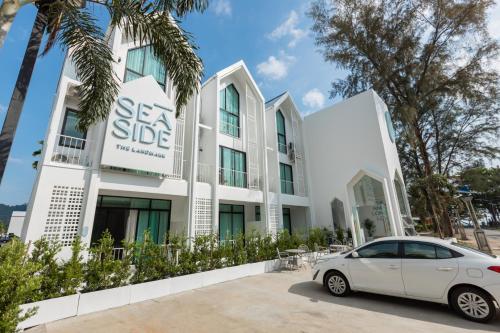 a car parked in front of a building at Sea Side at Ao Nang Landmark Night Market Krabi in Ban Khlong Haeng