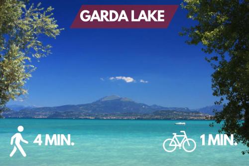 a poster for a lake with a man and a bike at Garda Lake View House - 1min from lake - WiFi - AC in Toscolano Maderno