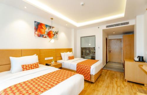 Una cama o camas en una habitación de Hotel Anu