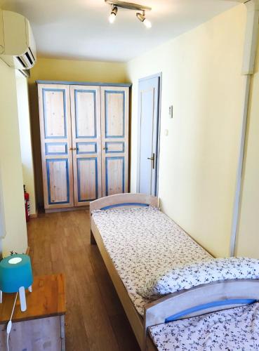 Ένα ή περισσότερα κρεβάτια σε δωμάτιο στο Old-town House Julia