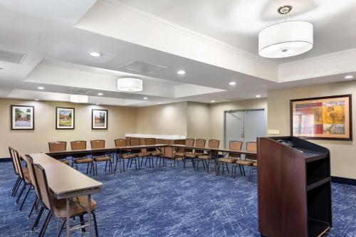 a conference room with a row of tables and chairs at Comfort Suites Hanes Mall in Winston-Salem