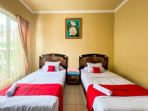 Cama o camas de una habitación en RedDoorz at Dieng 0KM