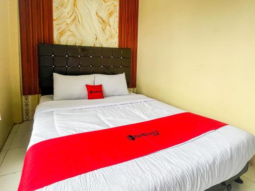 Cama o camas de una habitación en RedDoorz at Dieng 0KM