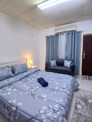 Llit o llits en una habitació de Al Ain Blue