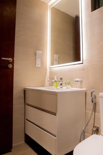 a bathroom with a sink and a mirror at Urban Oasis, Tri-Zen Luxury Apartment in Central Colombo in Colombo