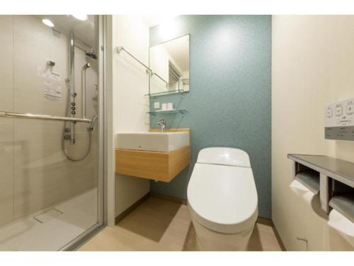 a bathroom with a toilet and a sink and a shower at The OneFive Kyoto Shijo - Vacation STAY 41806v in Kyoto
