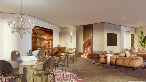 a living room with a kitchen and a dining room at SLS Barcelona in Barcelona