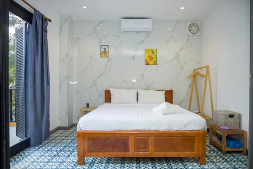 Cama o camas de una habitación en Hoian Beachfront Homestay