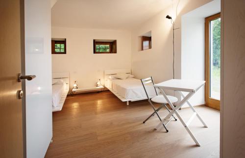 Albergo Diffuso Tolmezzoにあるベッド