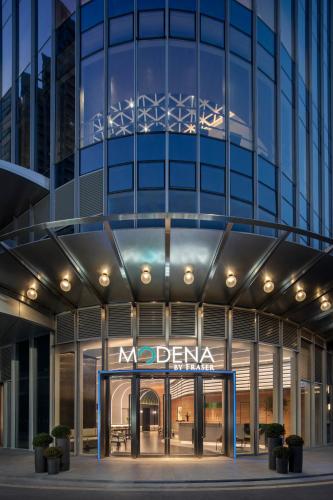 a building with a no drama sign in front of it at Modena By Fraser Shenzhen in Shenzhen