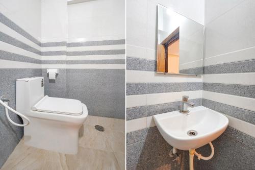 Un baño de FabExpress Royal N Comforts - Nr Shivoham Shiva Temple