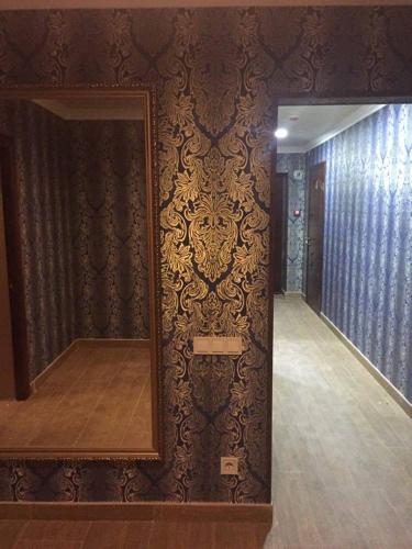 a mirror on a wall in a room at Argo in Lviv