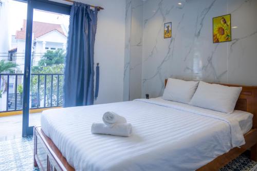 Cama o camas de una habitación en Hoian Beachfront Homestay