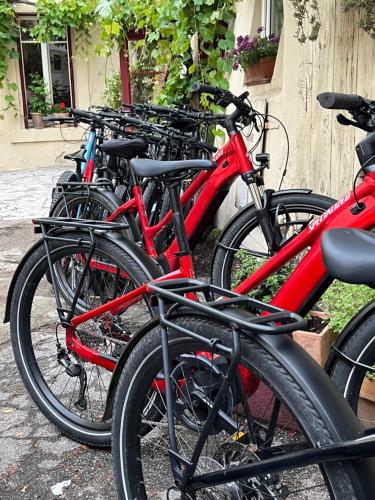 a row of bikes parked next to each other at Le Clos d'Orange - Hotel & ville de Provence in Orange