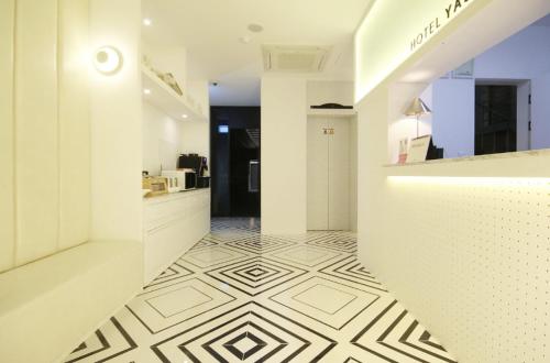 a white room with a white and black tile floor at Hotel YAJA Gwangju Hanam branch in Gwangju