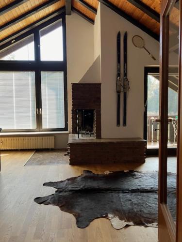 a living room with a large room with a large window at Apartment Waldglück in Dornhan