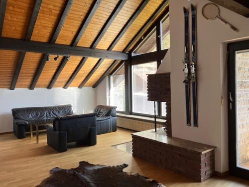 a living room with a couch and a table at Apartment Waldglück in Dornhan