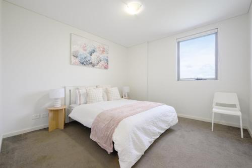 Ένα ή περισσότερα κρεβάτια σε δωμάτιο στο Chic One-Bedroom Hideaway with Free Parking&Wi-Fi