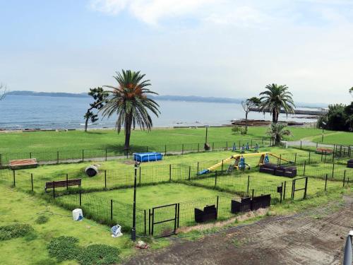 a park with a playground next to the water at Japari Tateyama - Vacation STAY 84008v in Tateyama