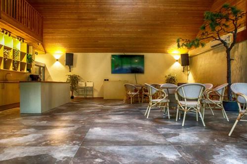 a large room with a table and chairs in it at Villa Pillapalu in Pillapalu