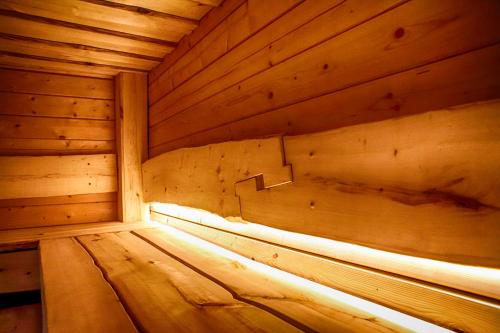 a inside of a wooden sauna with a light in it at Villa Pillapalu in Pillapalu