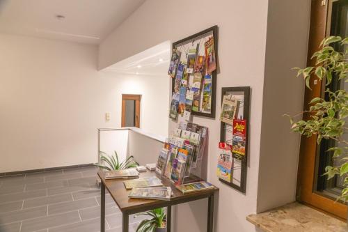 a room with a table and a refrigerator at Ferienwohnung Kloep in Serrig