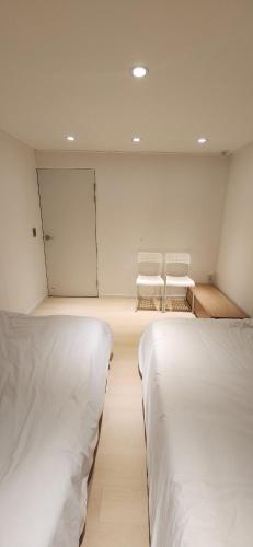 Mono House 101にあるベッド
