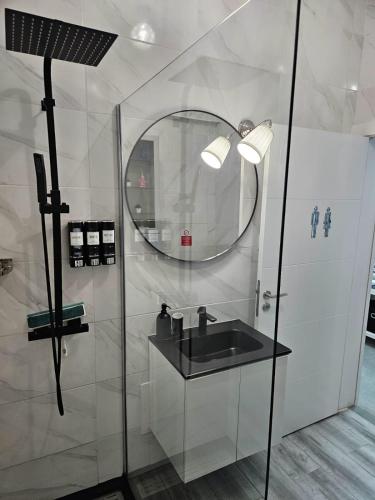 a bathroom with a sink and a mirror at Beach & House''Villa Maria'' 5 min to Mareta Beach in Sagres