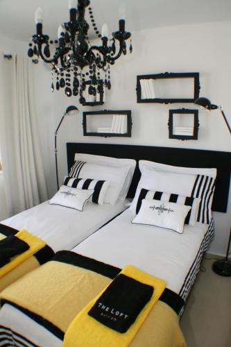two beds sitting next to each other in a bedroom at Lagada Resort in Makry Gialos