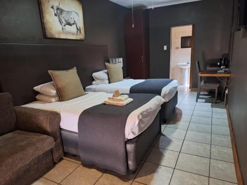 Postel nebo postele na pokoji v ubytování Kusile Guest House