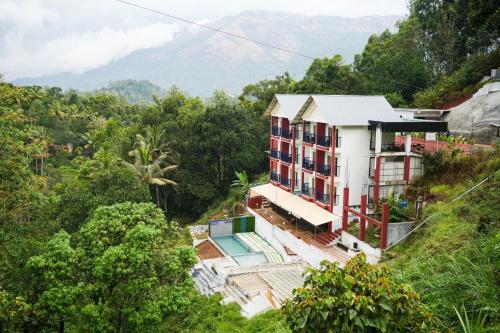 an aerial view of a house on a hill at Velvet Vista Munnar in Munnar