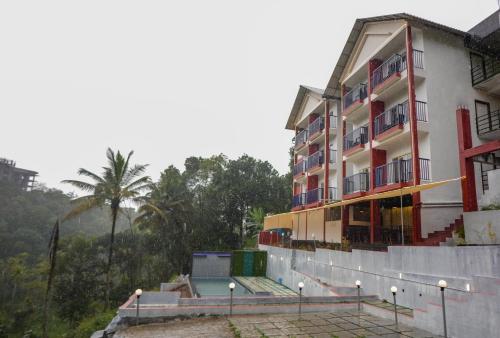 a building on the side of a hill at Velvet Vista Munnar in Munnar
