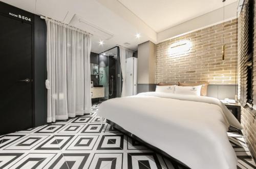 Ένα ή περισσότερα κρεβάτια σε δωμάτιο στο Awesome Boutique Hotel