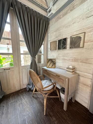 a room with a desk and a chair and a window at Villa S in Hua Hin