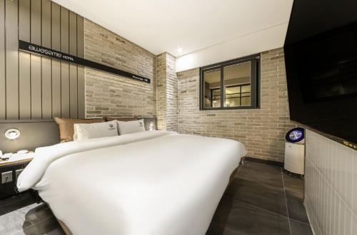 Ένα ή περισσότερα κρεβάτια σε δωμάτιο στο Awesome Boutique Hotel
