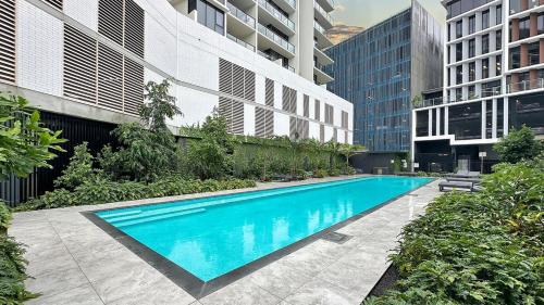 a swimming pool in the middle of a building at Luxury Maroochydore Apartment in Maroochydore