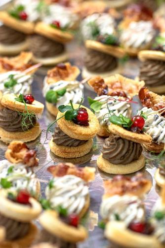 a display of cookies and pastries on a table at Villa Ariston in Opatija