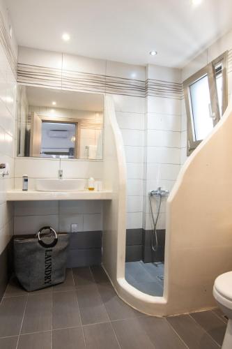 a bathroom with a sink and a toilet at Sea and sun in Nísos Skýros