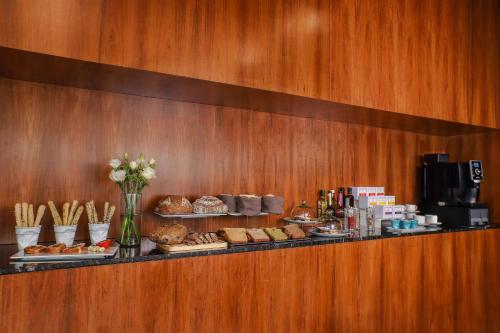 a buffet line with bread and pastries on at NH Mexico City Valle Dorado in Mexico City