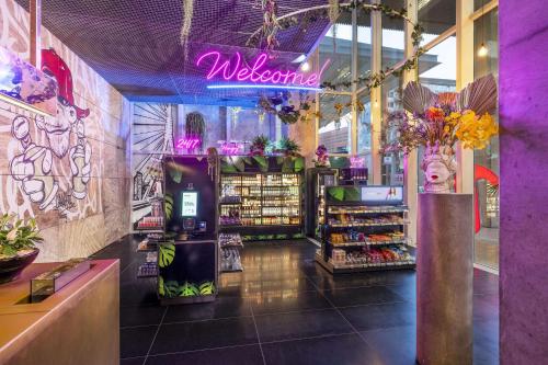 a store with a sign that says welcome in a store at nhow Rotterdam in Rotterdam