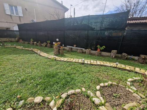 a garden with a fire hydrant in a yard at La casetta di Flo in Montecosaro