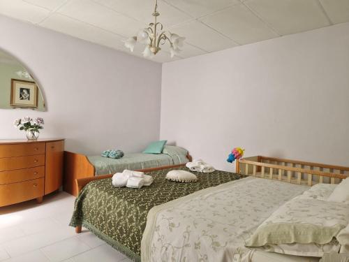 Postel nebo postele na pokoji v ubytování La casetta di Flo