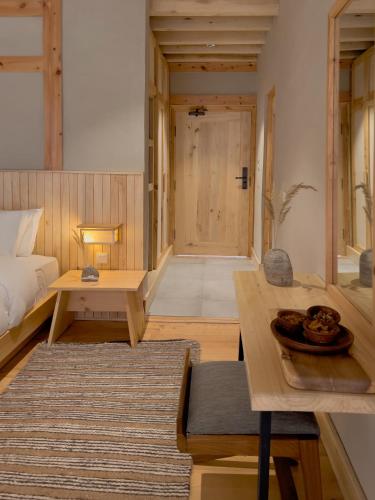 a living room with a bed and a table at The Rihla Hunza - Managed By Luxus in Hunza