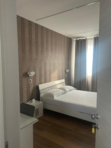 Posteľ alebo postele v izbe v ubytovaní Hotel Villa Ruggiero