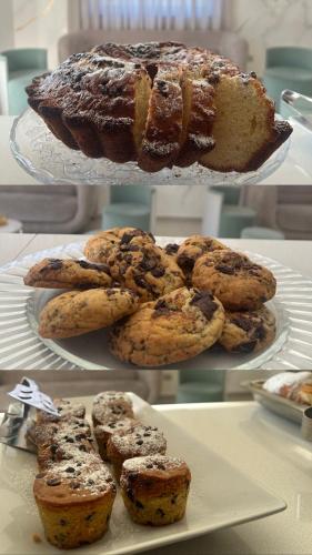 a plate of cookies and a cake on a table at Hotel Villa Ruggiero in Brusciano