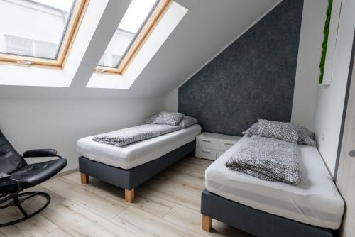 Postel nebo postele na pokoji v ubytování Jókai Apartman