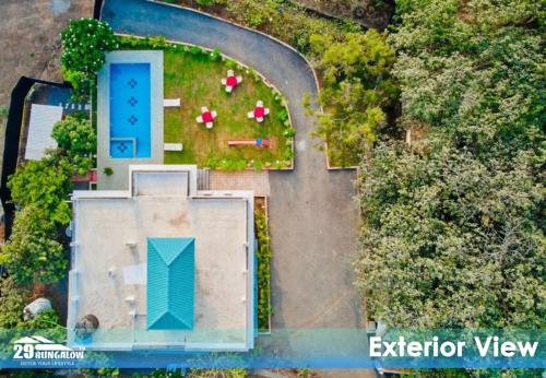 an aerial view of a house with a yard at Rooms At Harbour View Villa in Matralipāda